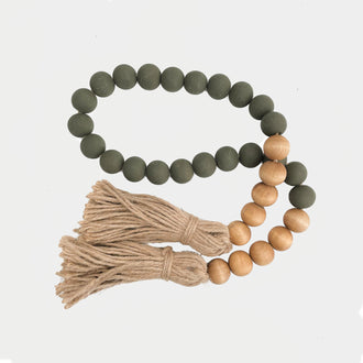 GREEN AND WALNUT WOODEN BEADS WITH JUTE TASSELS